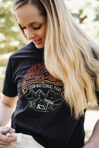 A girl wearing a Zion National Park tee from Wild Tribute