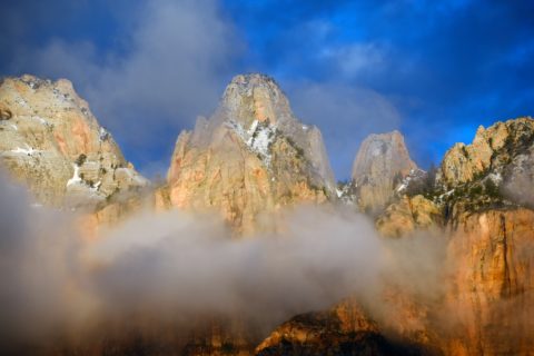 Fog and snow on top of Temples And Towers of the Virgin in Zion National Park